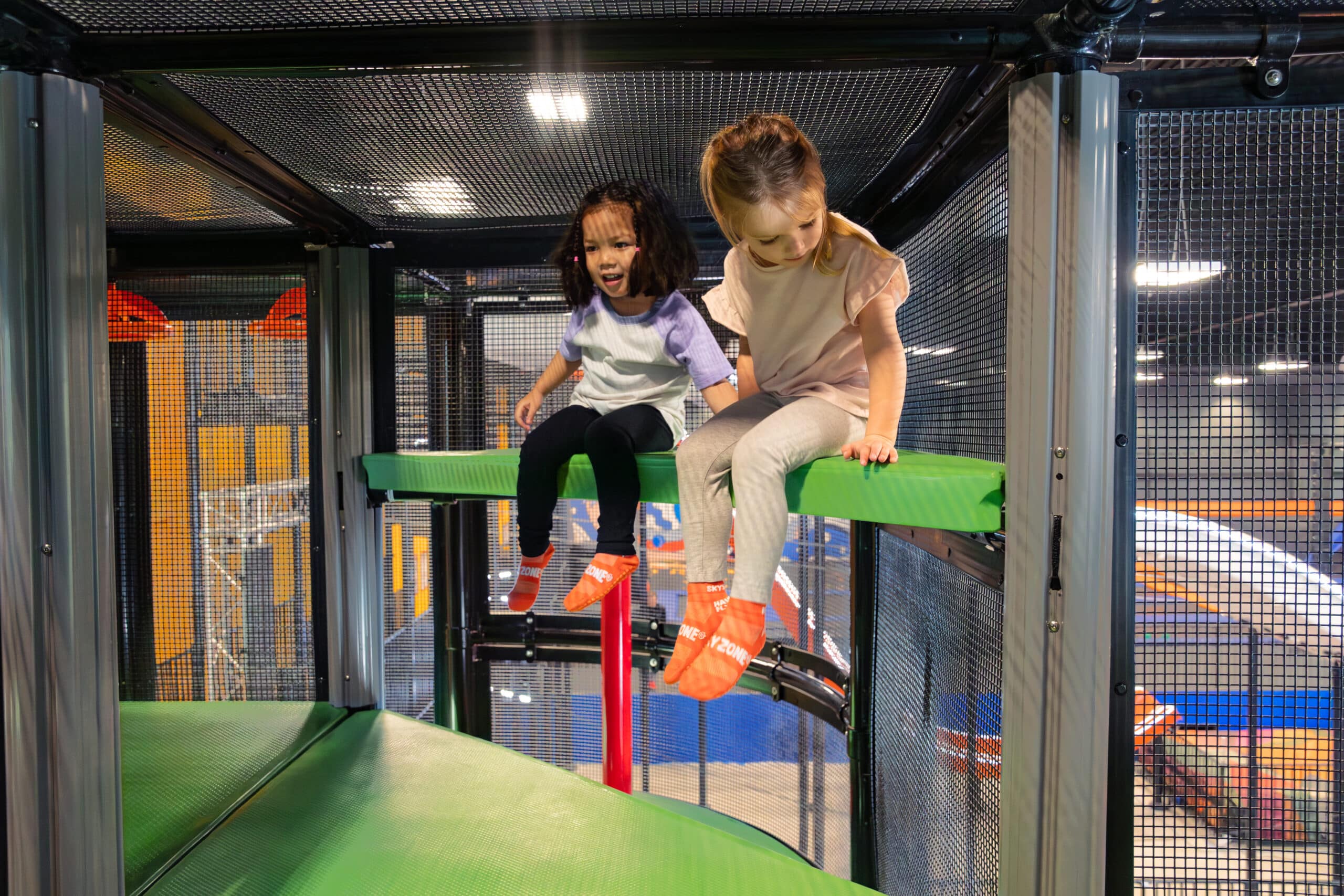 Two toddlers playing at a sky zone